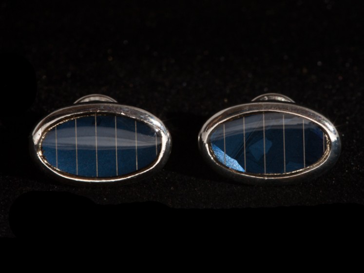 A distinctive gift for a fan of cufflinks. Each oval cufflink is inset with a real piece of dark blue crystalline photovoltaic solar cell.